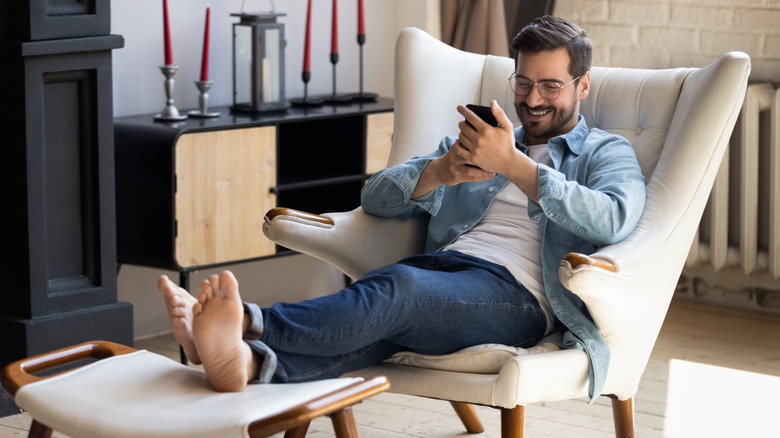 man relaxing with his feet up in the living room