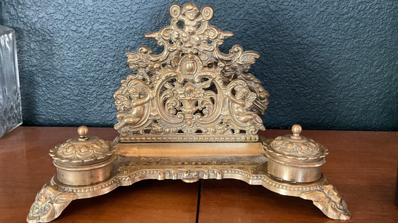antique letter holder on table