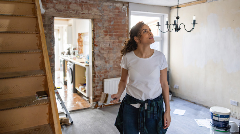 Woman standing in a house under renovation