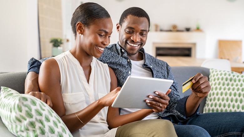 A couple looks through a document