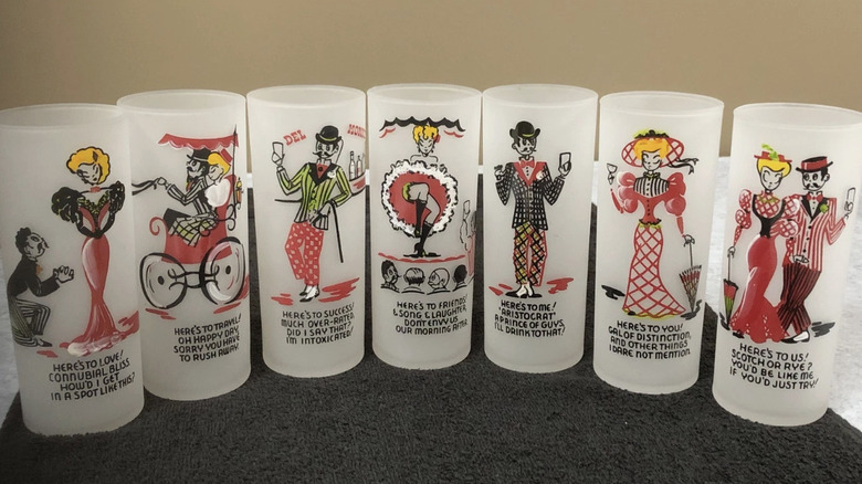 A collection of seven Gay Fad glasses with cartoon prints