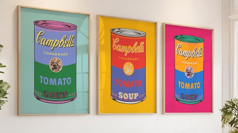 Framed Andy Warhol Campbell Soup Cans Print on living room wall