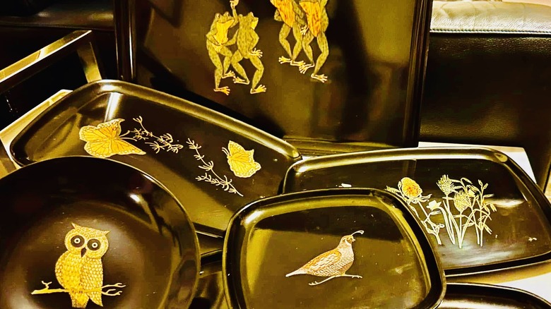 Collection of Couroc trays.