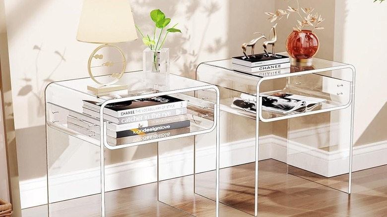 a clear acrylic table with shelf in a living room