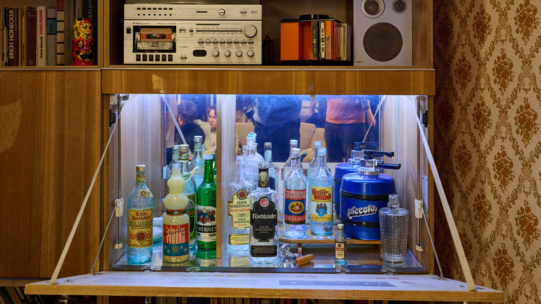 retro 1970s liquor cabinet open with mirrored back