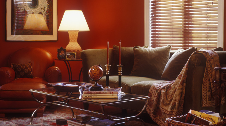 an 80s-style vintage living room with couch, coffee table, and a lamp