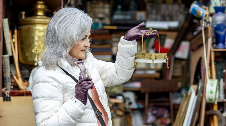 Woman shopping in thrift store