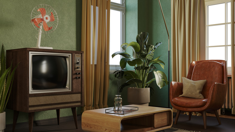Retro living room with stylish furniture and vintage accessories.