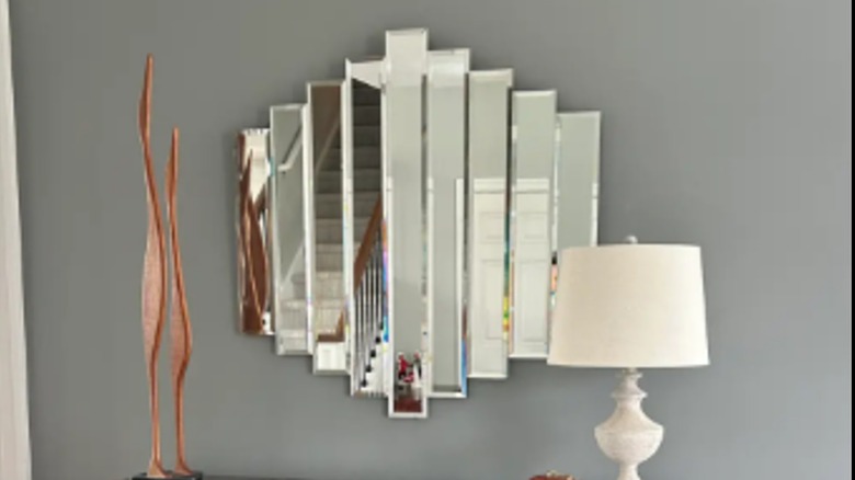An '80s Art Deco mirror decorates a wall.