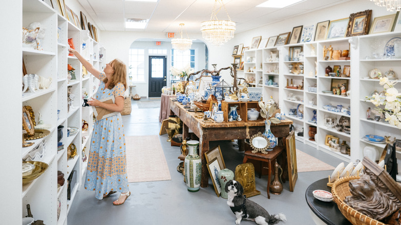 Woman browsing antique store.