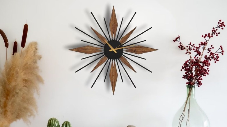 Starburst clock hanging on wall