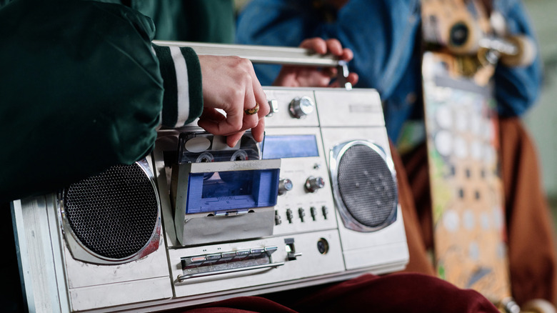 Teenagers listening to a boombox