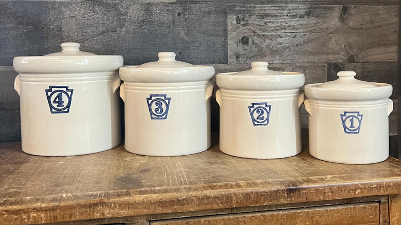 Numbered canisters or crocks with Pfaltzgraff's Yorktowne pattern.