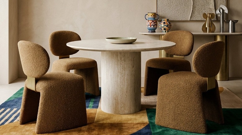 A travertine table is part of the setup of a modern living room