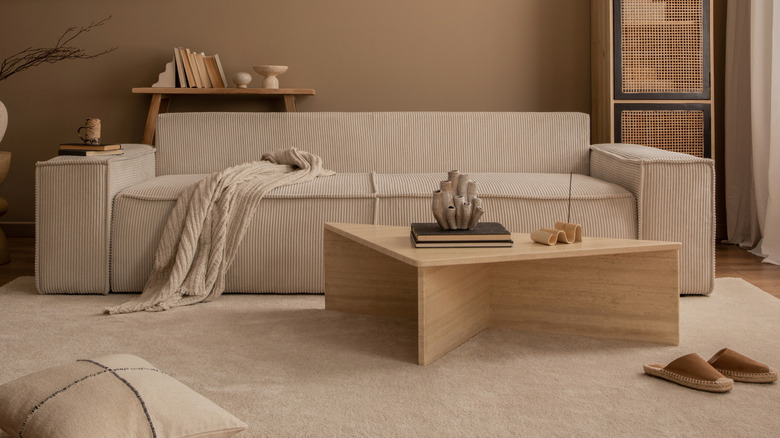 A travertine coffee table in a minimalist living room