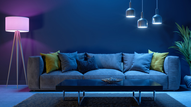 Purple lighting in lamp with basic living room setup