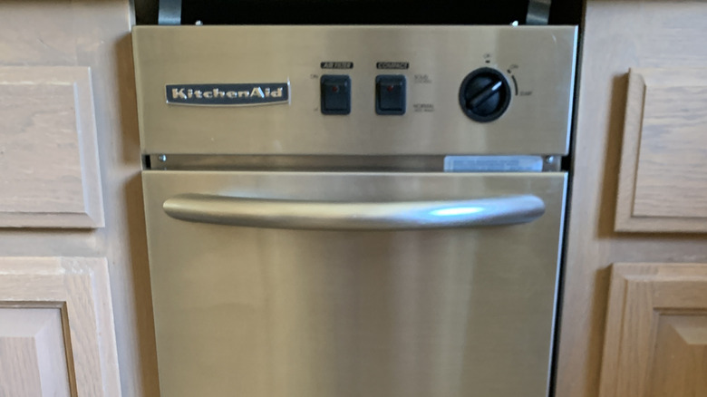 Closeup of trash compactor in a kitchen