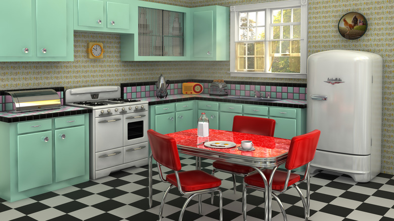 Retro kitchen with vintage appliances and seafoam green cabinets