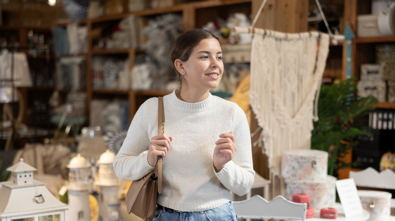 woman shopping in a thrift store
