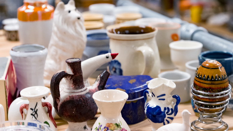 Second hand vases and items on thrift store shelf