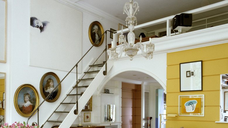 Retro home with various portraits and wall art