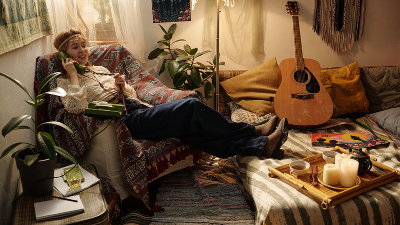 Young woman in a 1970s living room