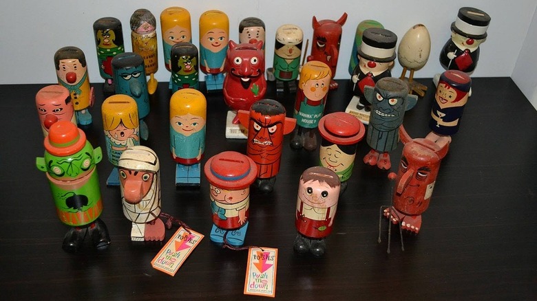 A collection of Popsie figurines on a table
