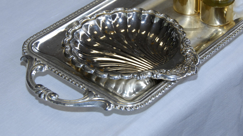 Silver shell tray on larger rectangular silver tray