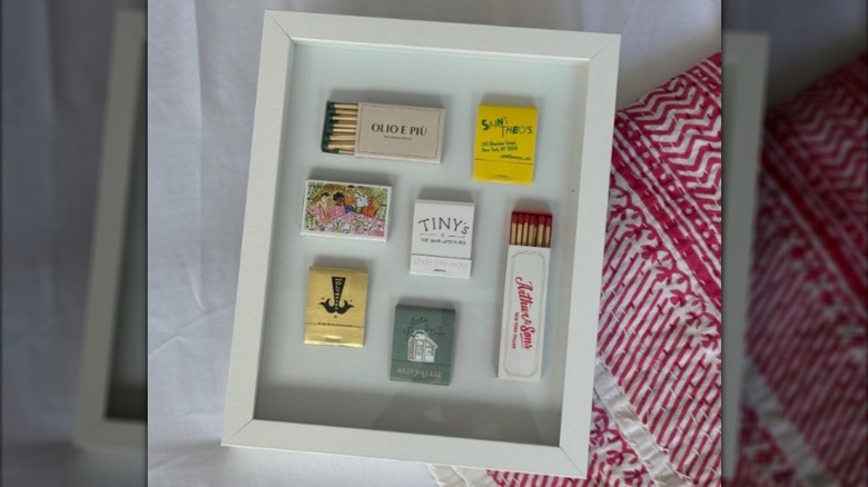Framed vintage matchboxes.
