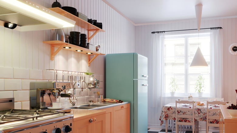 Retro kitchen with a pastel green fridge