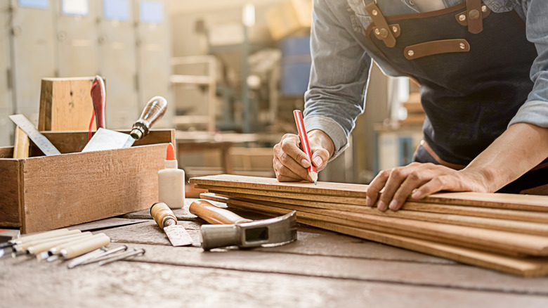 carpenter working with wood plants