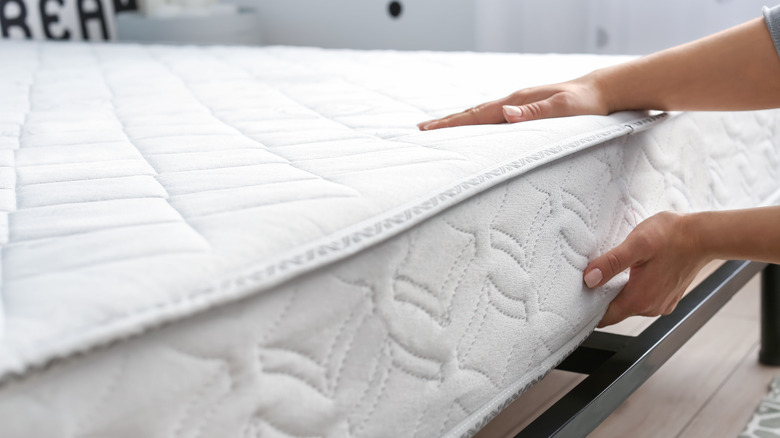 woman testing mattress display