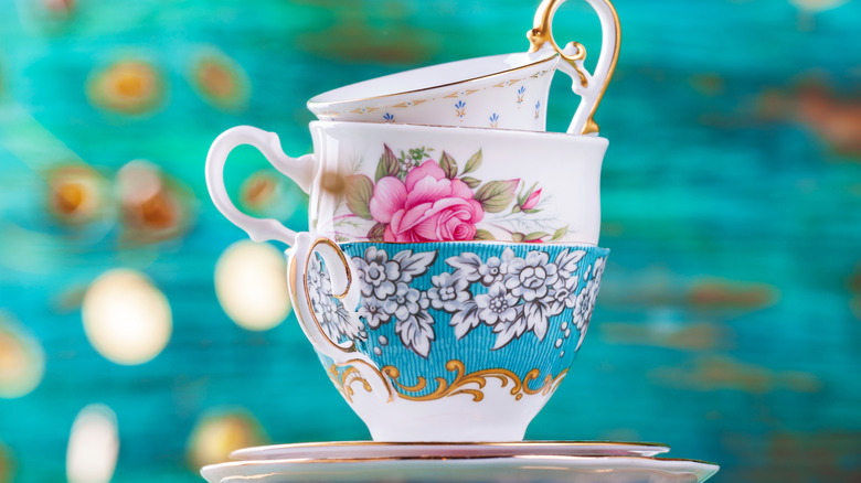 vintage teacups turquoise background