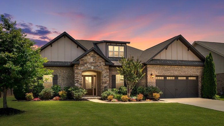 Contemporary home with brick and stone