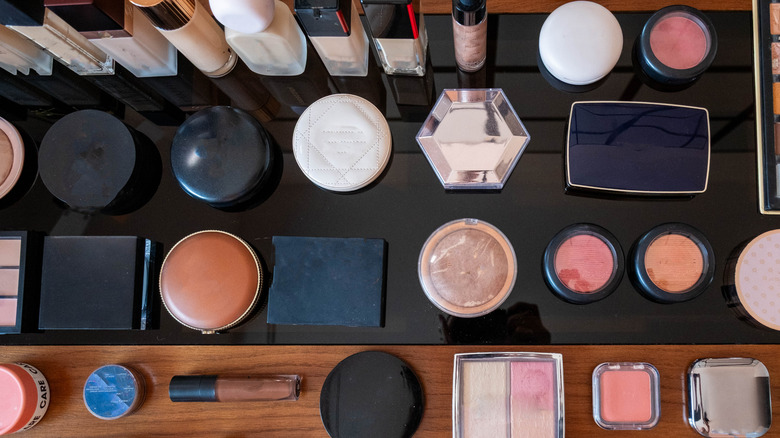 Overhead view of various cosmetics on a table
