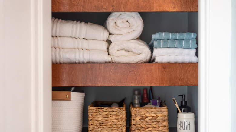 Towels folded neatly and placed on a shelf