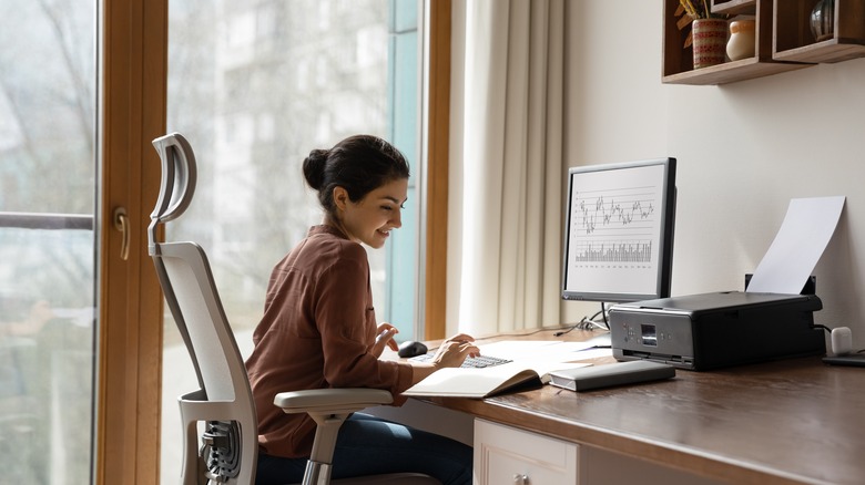 Girl sitting at desk and typing