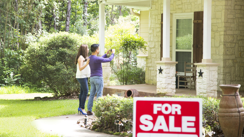 couple looking at house for sale