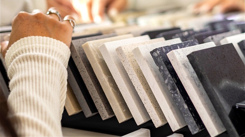 person looking through countertop samples