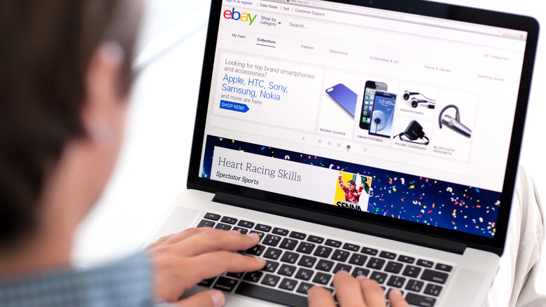 Person looking for items on eBay using their laptop