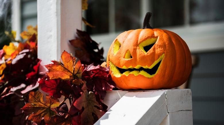 Carved pumpkin on porch