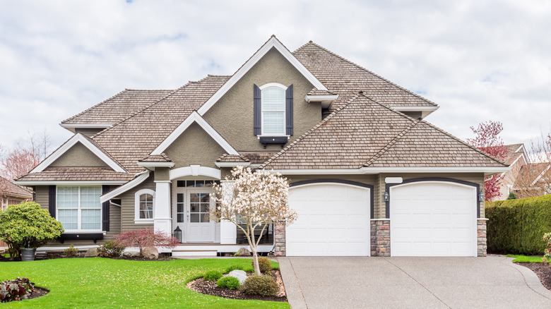 A tan home white trim