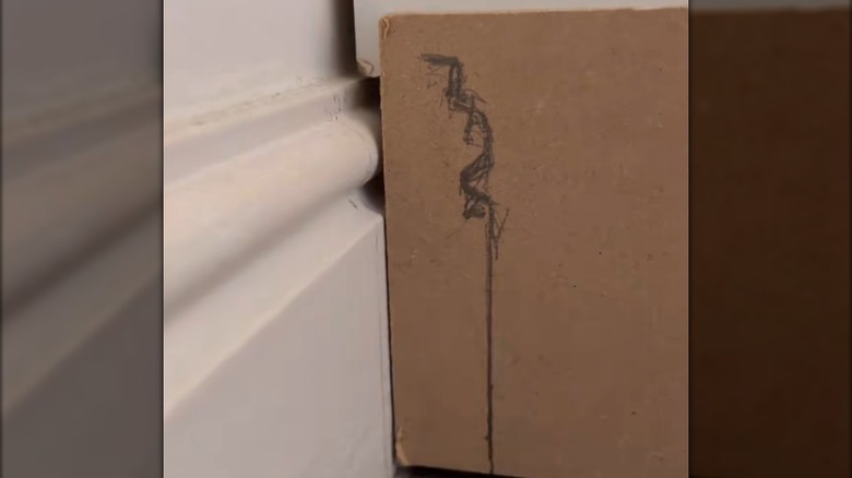 A scribe tool was used to trace the contours of baseboards onto trim.