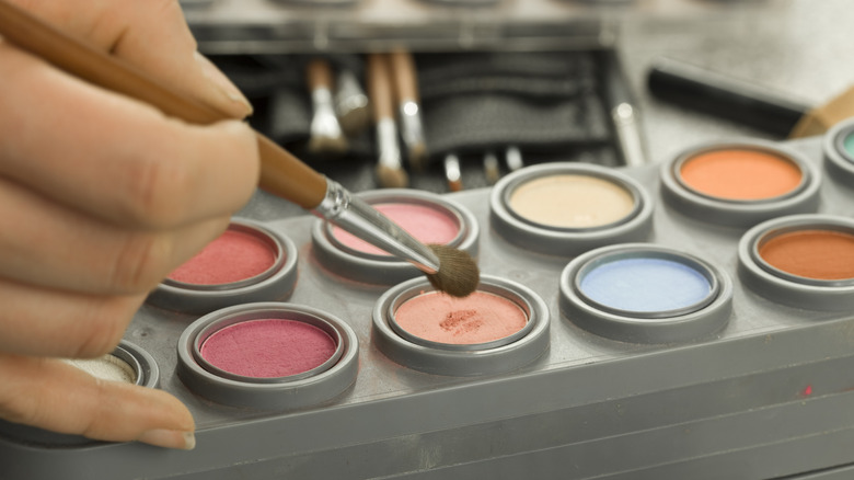 Crafting flowers with colorful pipe cleaners.