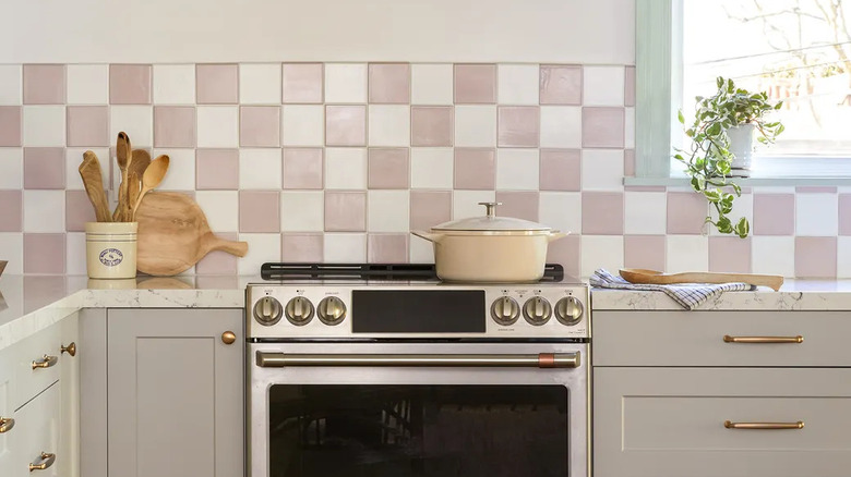 Kitchen with pink and white checkered tile backsplash