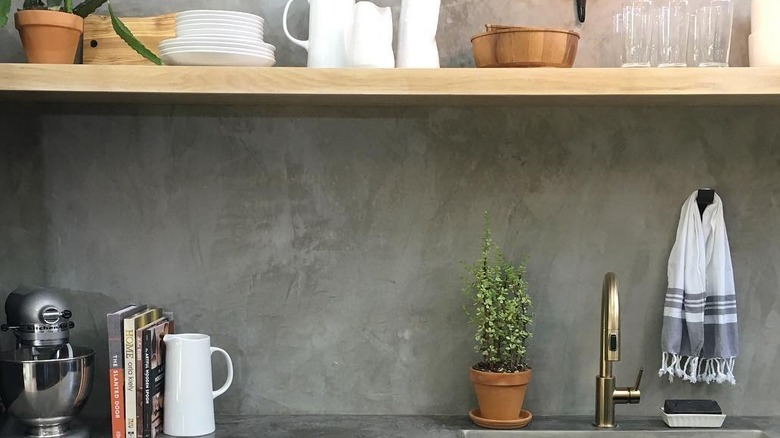 Joanna Gaines-designed kitchen with concrete backsplash