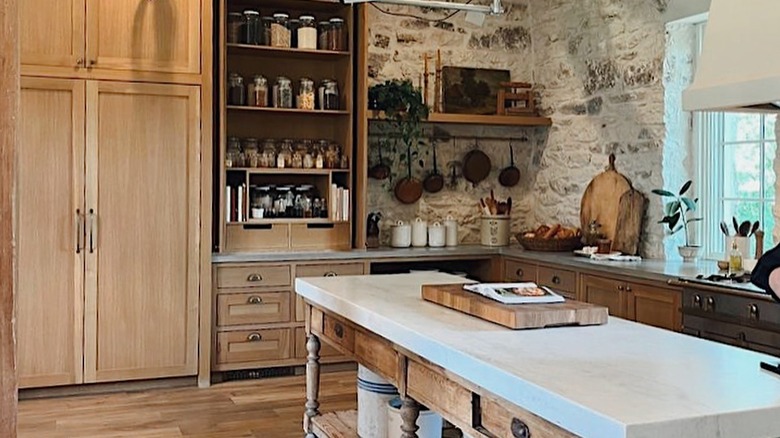 Joanna Gaines' Magnolia Table cooking show kitchen with stone walls