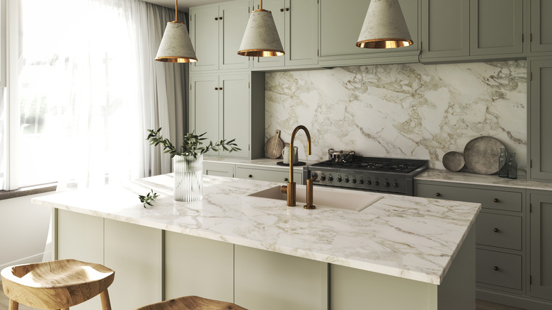 Kitchen with marble slab counters and backsplash