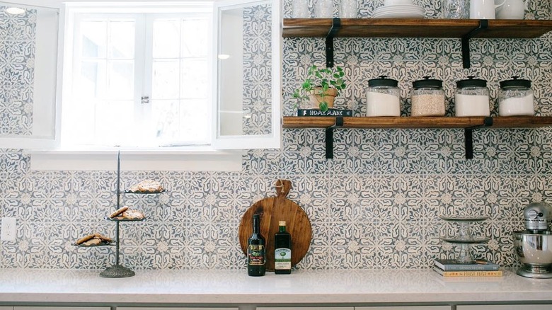 Joanna Gaines-styled kitchen with hand-painted tile backsplash