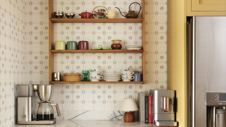 Kitchen with patterned wallpaper as backsplash